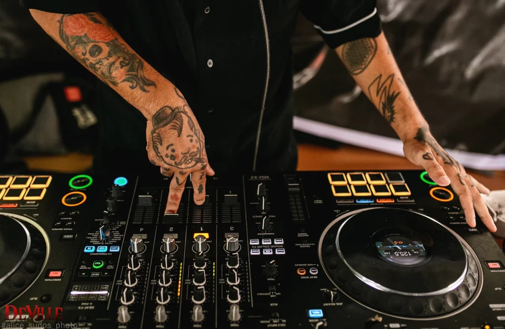 A person playing on a DJ system