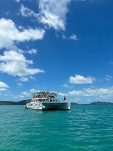 Front facing photo of Nautibeat luxury catamaran sailing away from Koh Samui